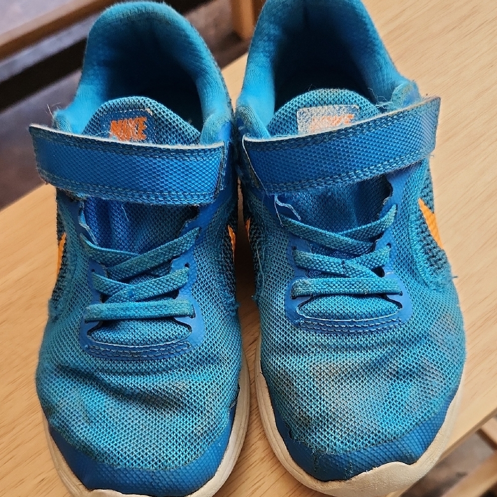 Nike Kids Blue Athletic Sneakers with Orange Swoosh